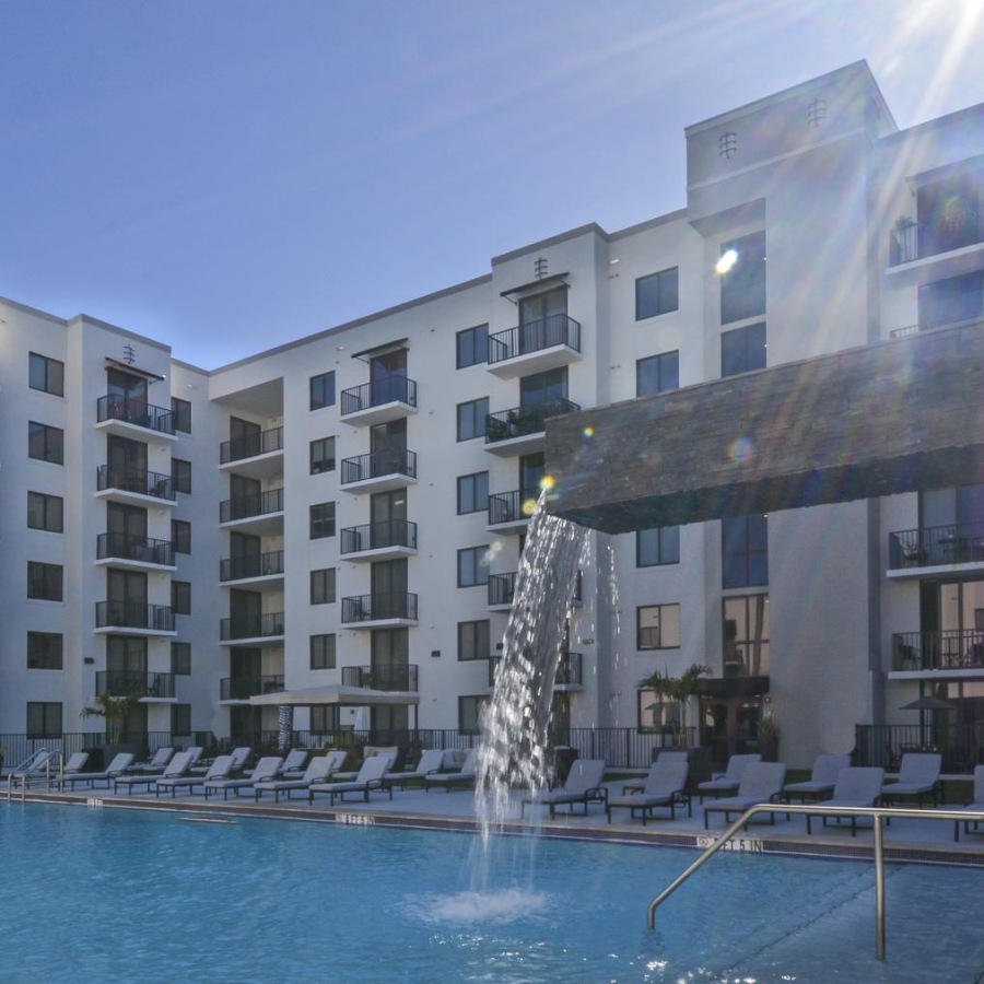 a large building with a pool